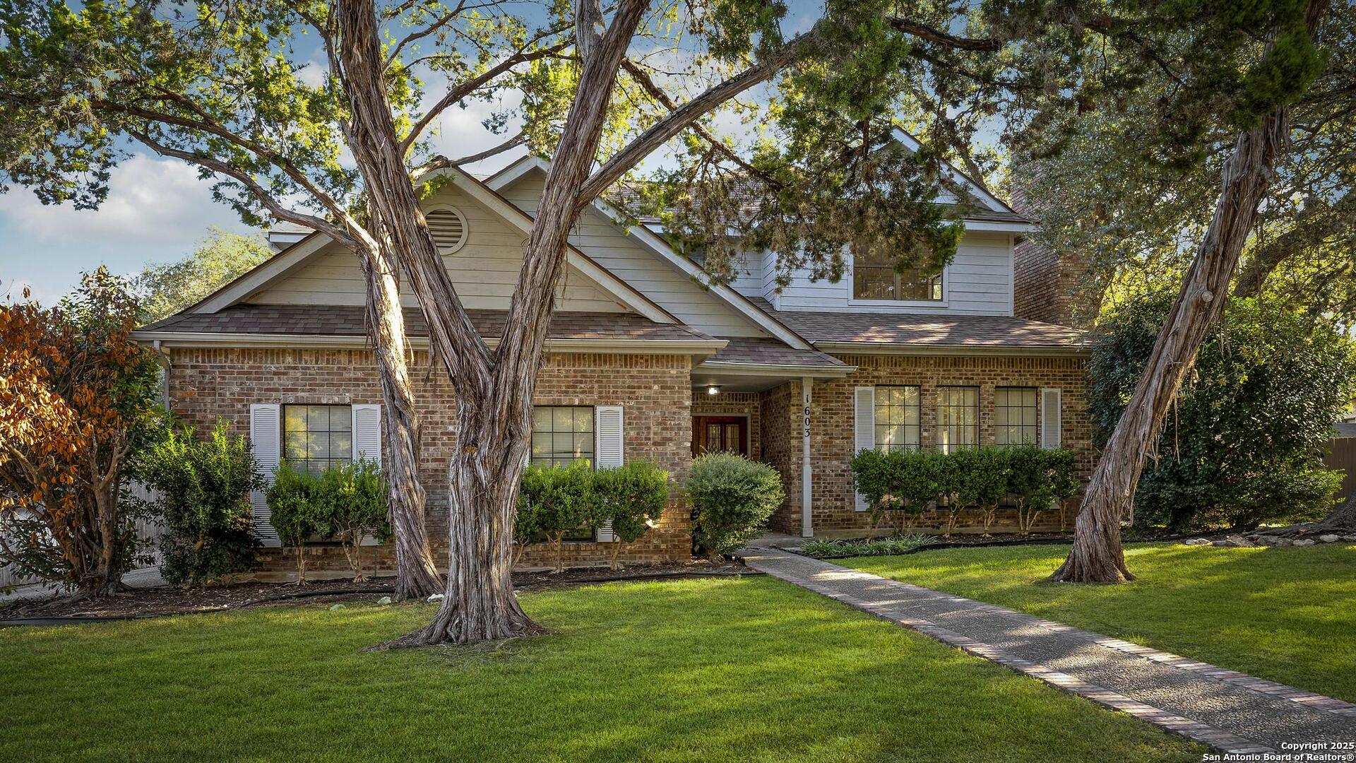 1603 Hawks Ridge Street San Antonio, TX 78248 - Photo 2 of 39 a front view of a house with a yard