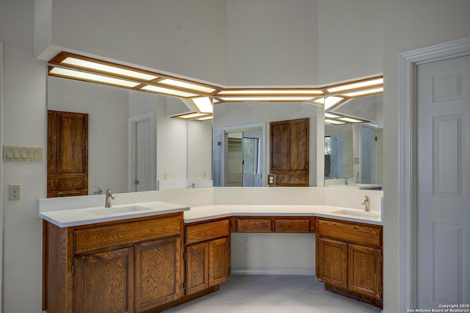 1603 Hawks Ridge Street San Antonio, TX 78248 - Photo 22 of 39 a bathroom with a sink and a mirror