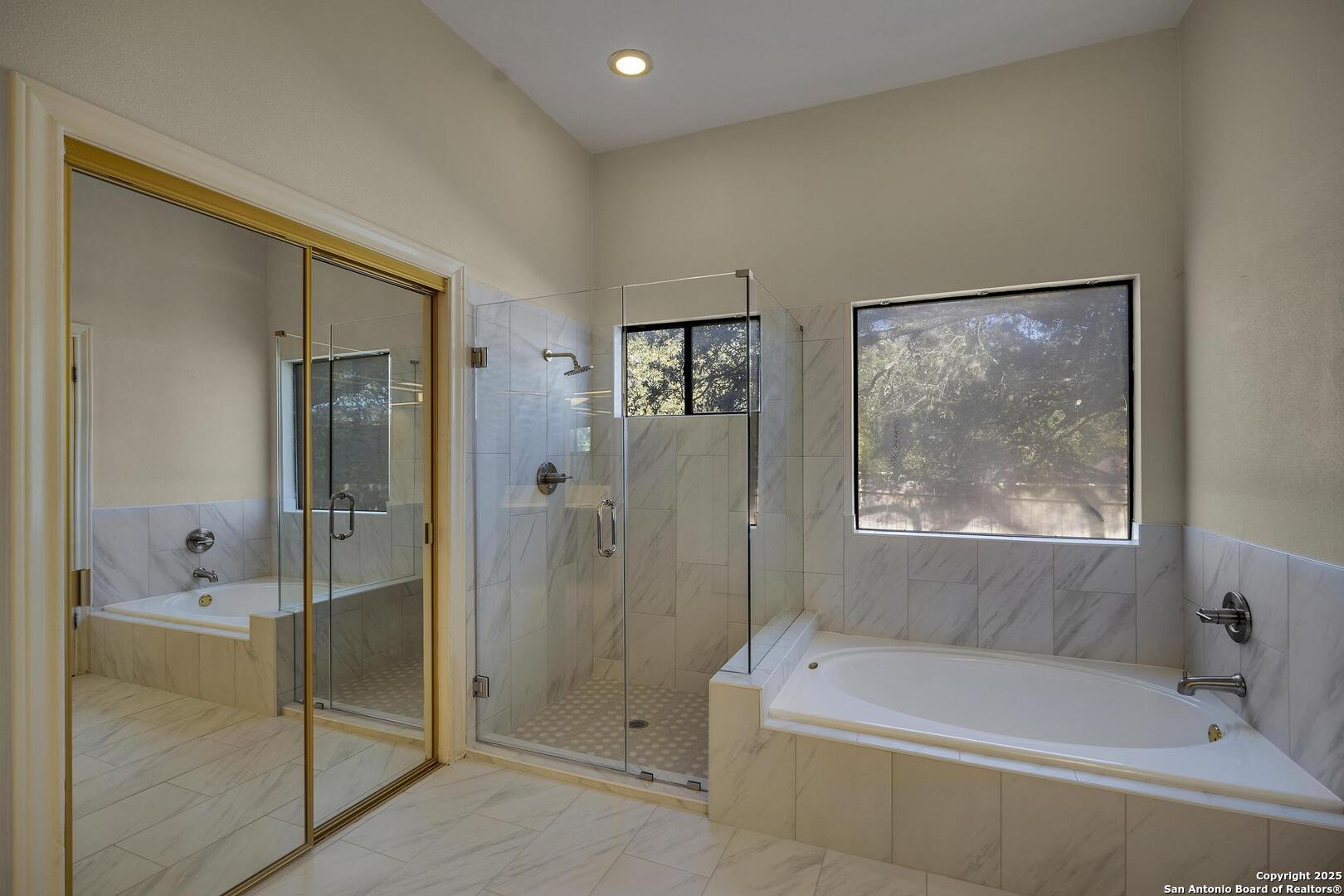 1603 Hawks Ridge Street San Antonio, TX 78248 - Photo 23 of 39 a bathroom with a tub shower and sink