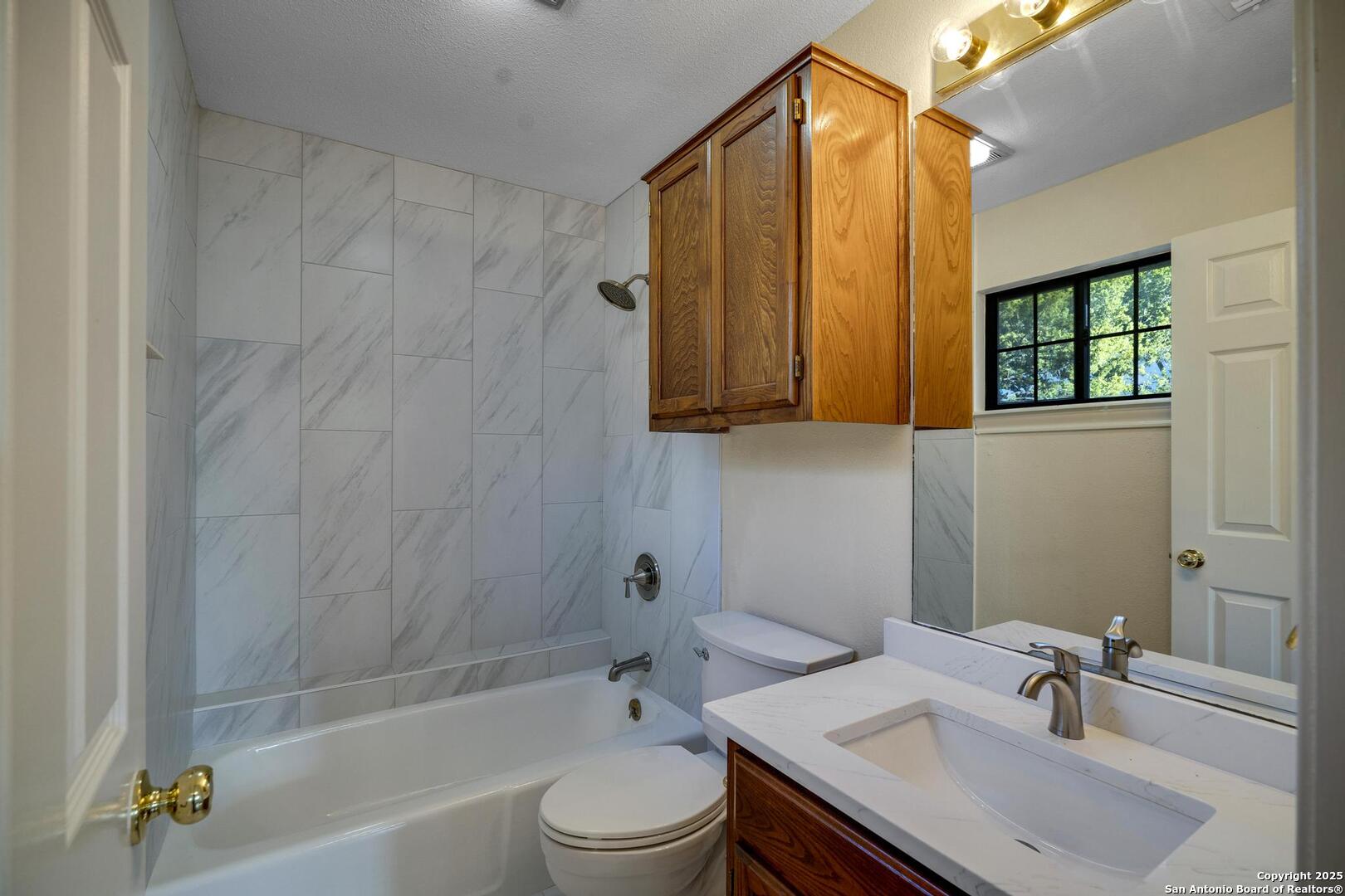 1603 Hawks Ridge Street San Antonio, TX 78248 - Photo 26 of 39 a bathroom with a sink a toilet and shower