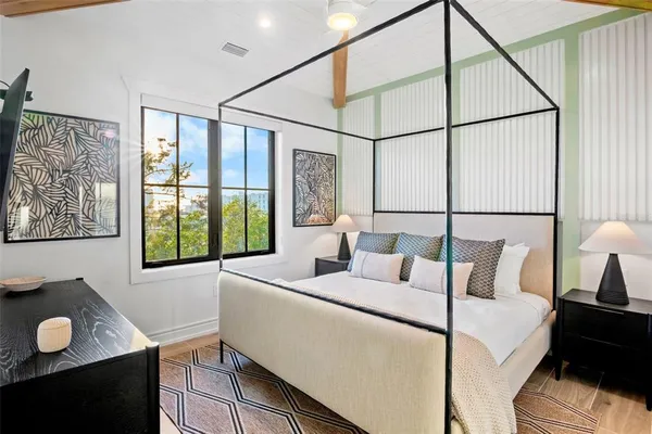 a bedroom with bed and a window