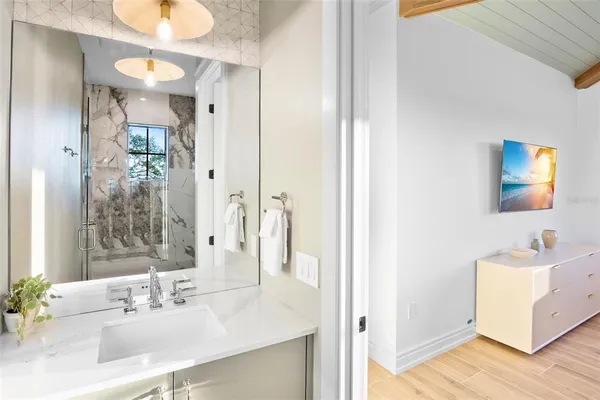 a bedroom with a bed and a view of bathroom
