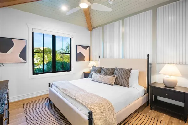 a view of a house with backyard outdoor seating and swimming pool