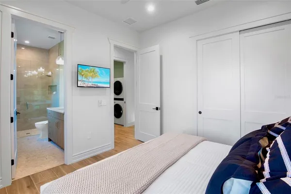 an aerial view of residential house with outdoor space and trees all around