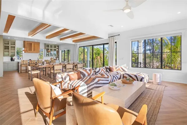 a view of a kitchen with kitchen island dining table and wooden floor