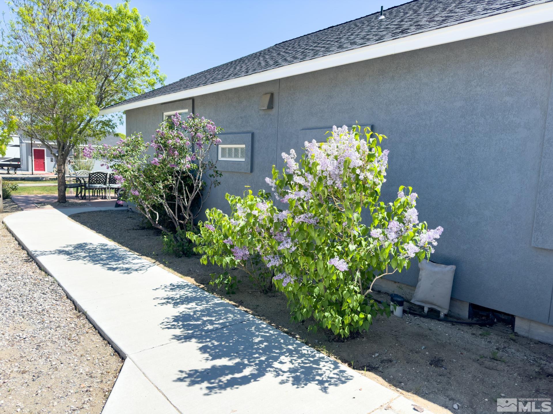 1880 Sky Ridge Drive Fallon, NV 89406 - Photo 32 of 40 a front view of a house with a yard