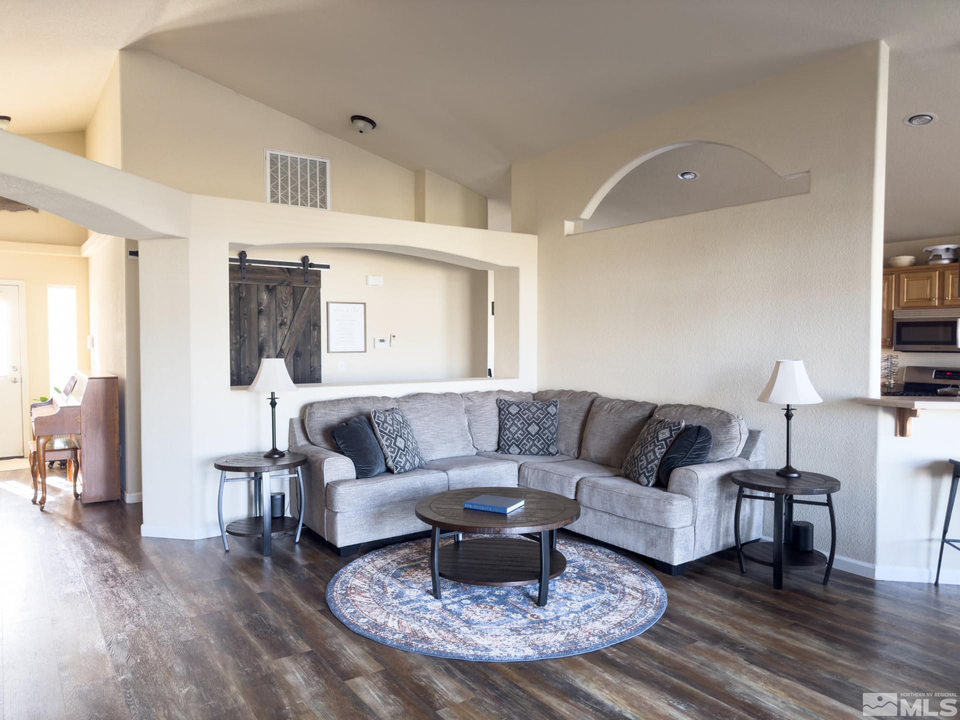 1880 Sky Ridge Drive Fallon, NV 89406 - Photo 7 of 40 a living room with furniture and a wooden floor