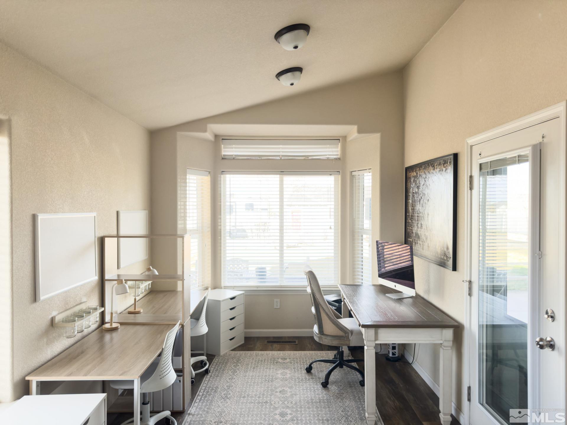 1880 Sky Ridge Drive Fallon, NV 89406 - Photo 10 of 40 a view of a workspace with furniture and a window