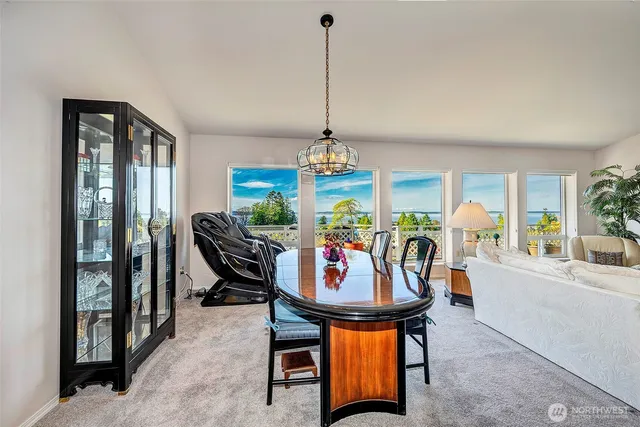 a view of a dining room with furniture window and outside view