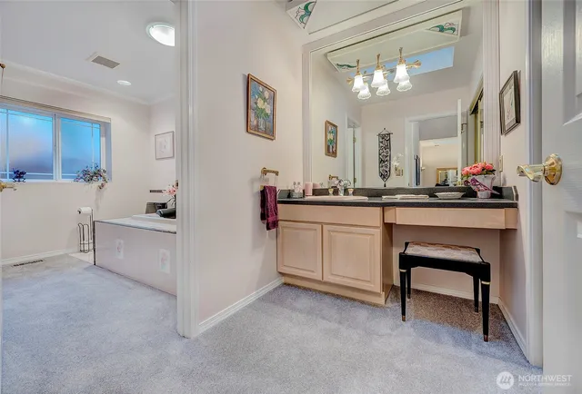 a kitchen with a sink cabinets and window