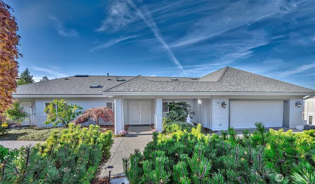 a front view of a house with garden