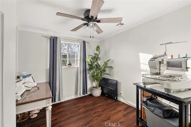 a view of a workspace with furniture and a workspace