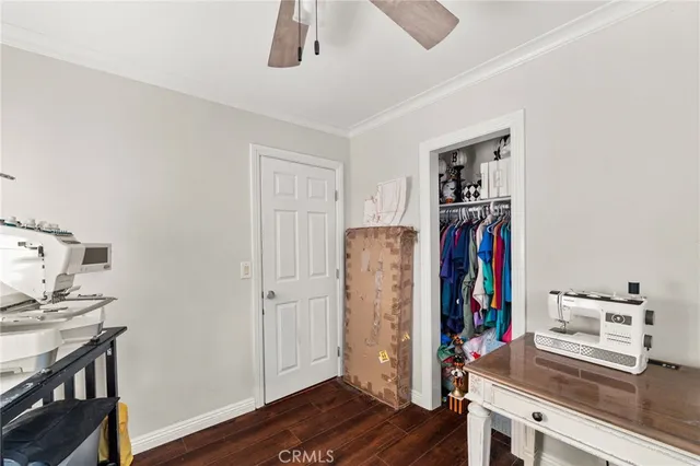 a view of a workspace with furniture and wooden floor