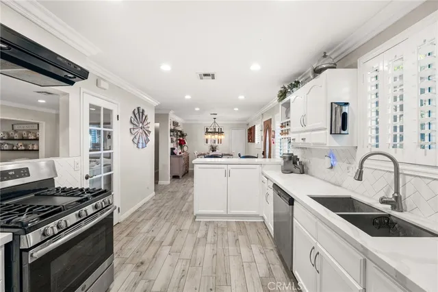 a kitchen with a sink stove and refrigerator