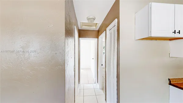 a view of a bathroom with a shower and sink
