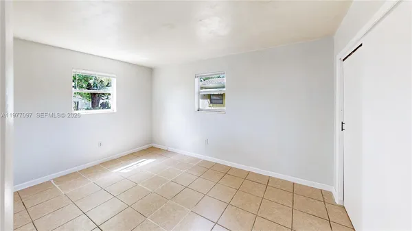 an empty room with windows