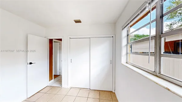 a view of a hallway with a glass door