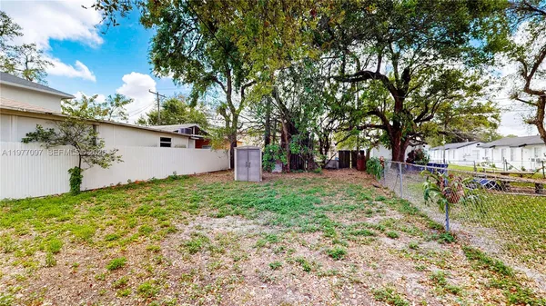 a view of a backyard with tree s