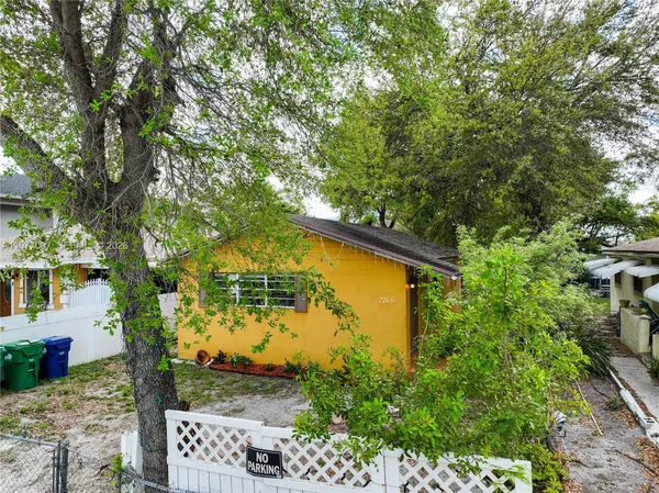 a bird view of a house with a yard