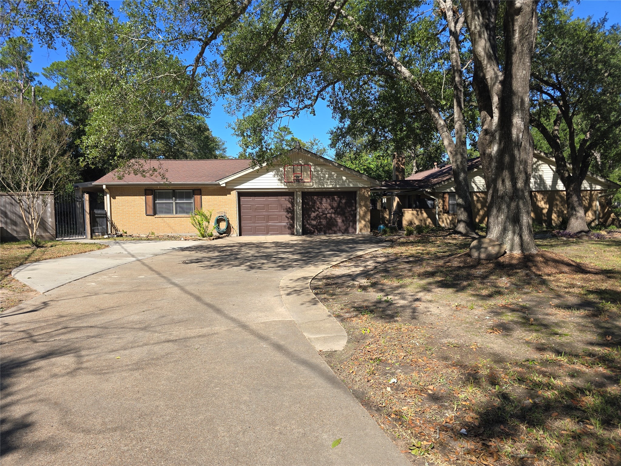 19103 Whitewood Drive Spring, TX 77373 - Photo 29 of 38 Doublewide driveway with extra parking for the guest house/MIL suite. Basketball goal for you games with plenty of space. This photo only shows half the length of the driveway!
