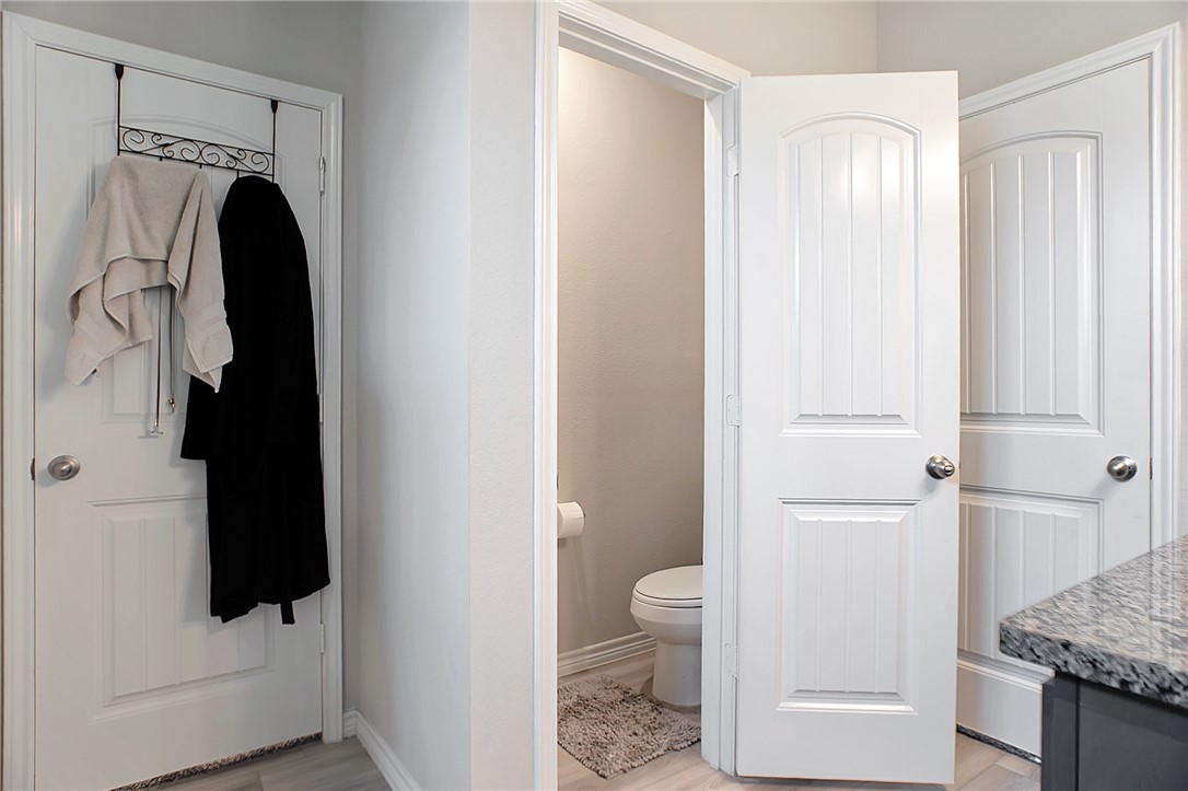 2037 Rock Rdg Avenue Bryan, TX 77807 - Photo 11 of 27 a bathroom with a granite countertop sink toilet and shower