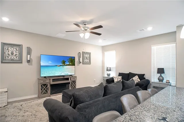 a bedroom with a bed and a lamp