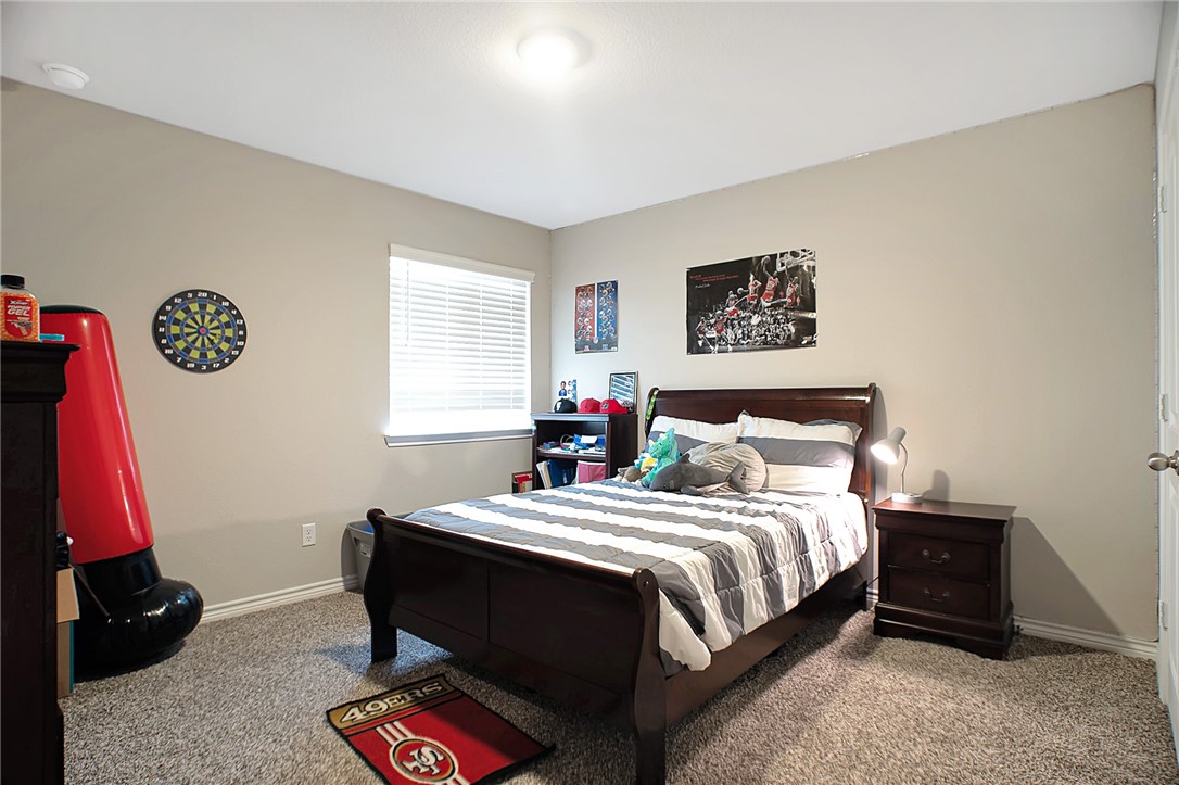 2037 Rock Rdg Avenue Bryan, TX 77807 - Photo 16 of 27 a bedroom with a bed and a desk