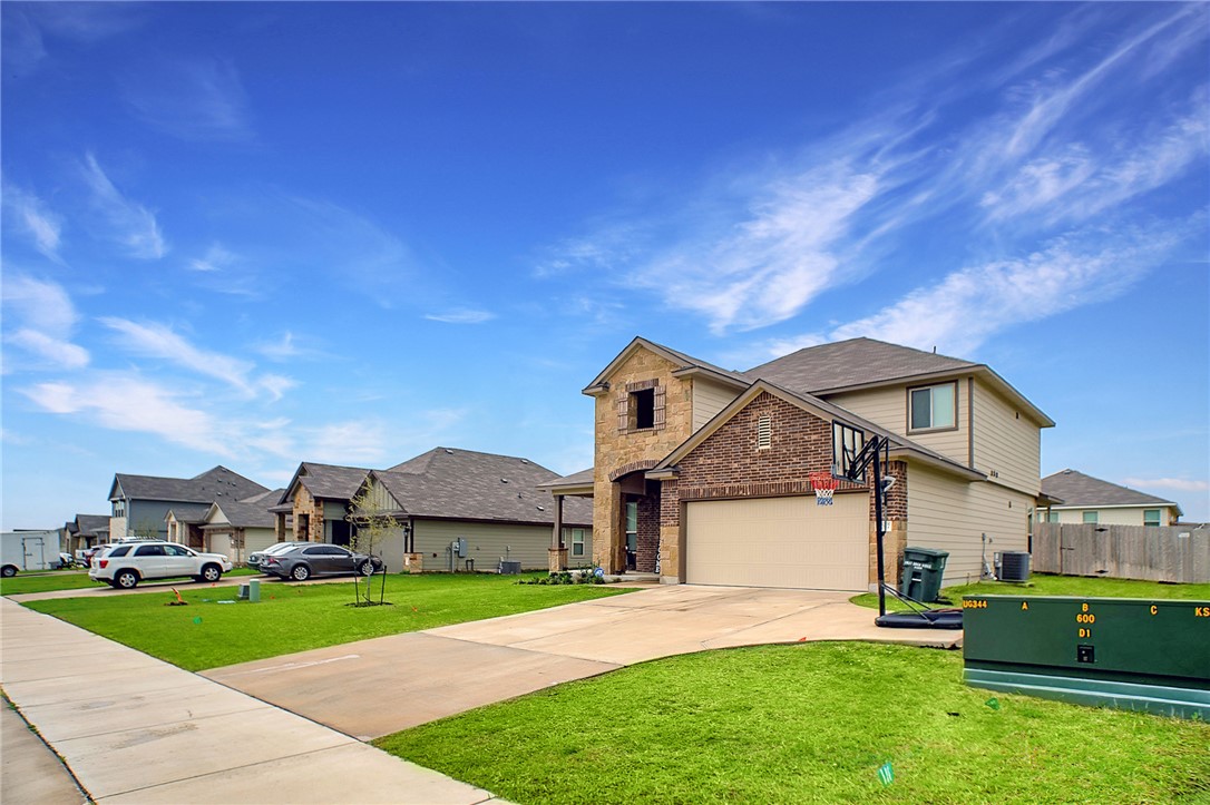 2037 Rock Rdg Avenue Bryan, TX 77807 - Photo 17 of 27 a front view of a house with a yard