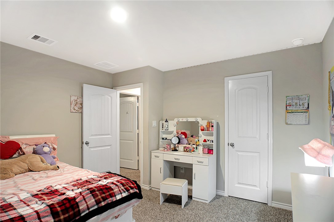 2037 Rock Rdg Avenue Bryan, TX 77807 - Photo 19 of 27 a bedroom with a bed and a window