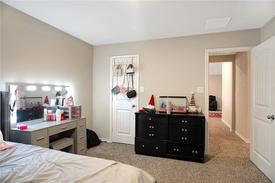 2037 Rock Rdg Avenue Bryan, TX 77807 - Photo 21 of 27 a bedroom with a bed and a dresser
