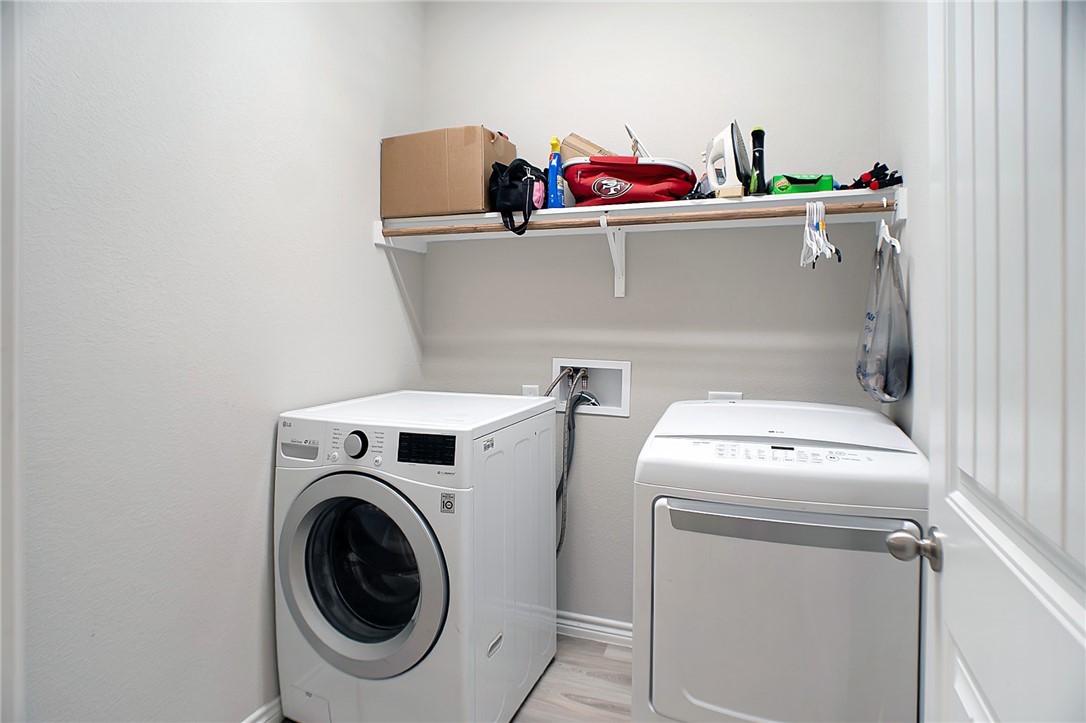 2037 Rock Rdg Avenue Bryan, TX 77807 - Photo 23 of 27 a utility room with dryer and washer
