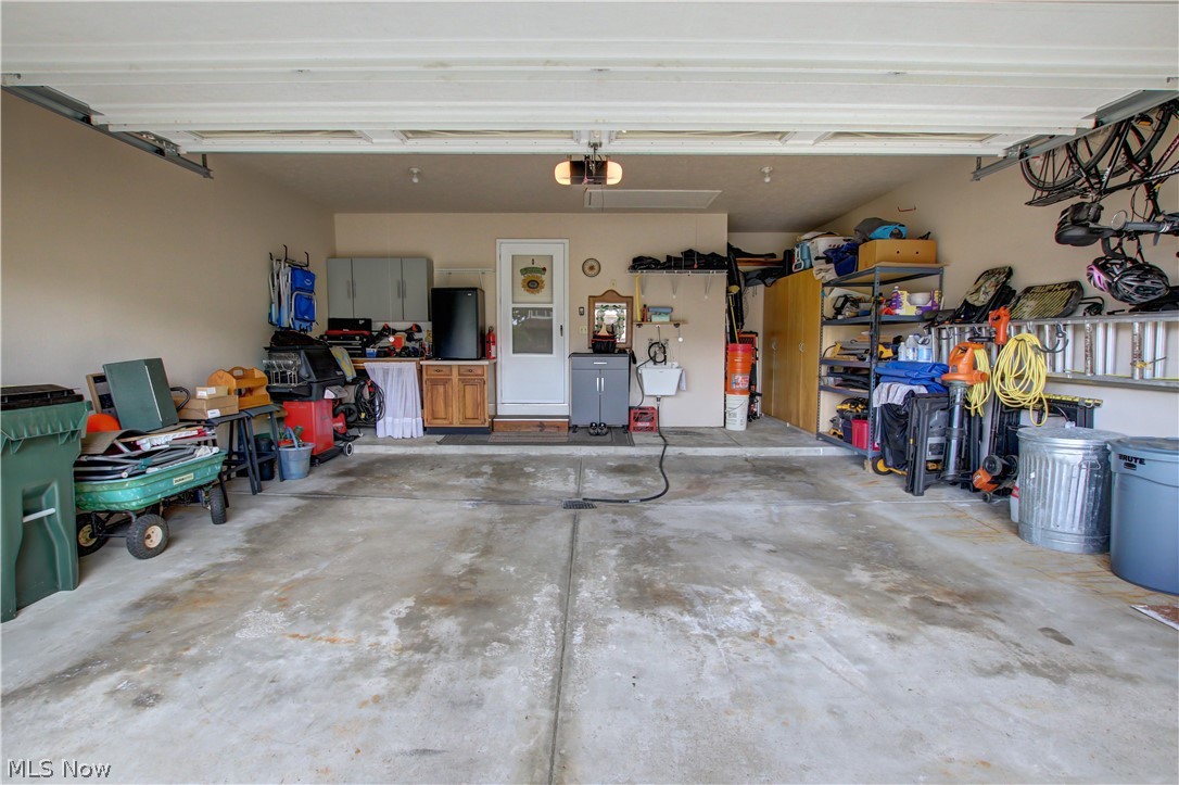 1010 Rustic Trail Cleveland, OH 44134 - Photo 33 of 49 Garage featuring a garage door opener