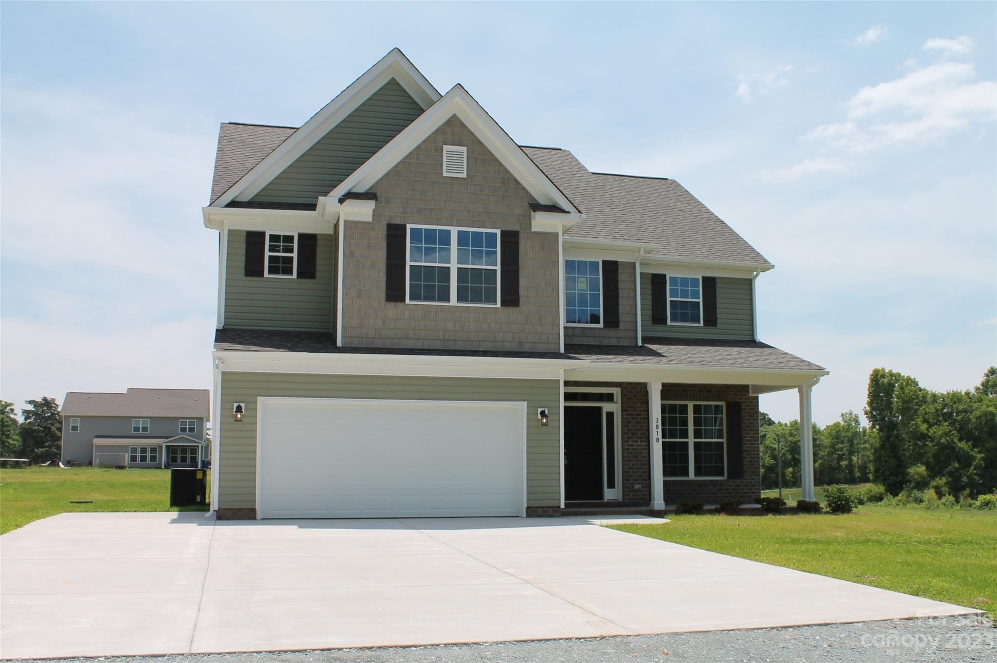 3818 New Salem Road Monroe, NC 28110 - Photo 1 of 15 a front view of a house with a yard and garage