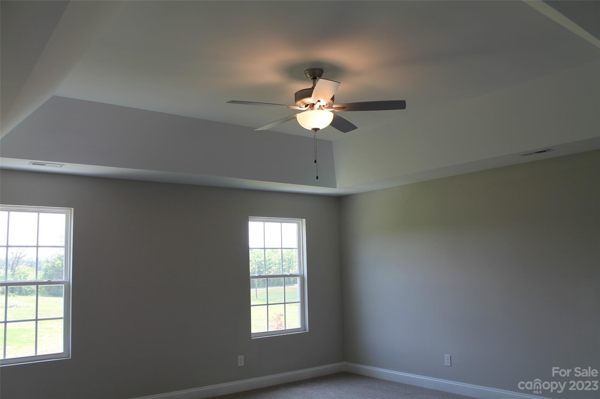 3818 New Salem Road Monroe, NC 28110 - Photo 11 of 15 an empty room with a window and a fan