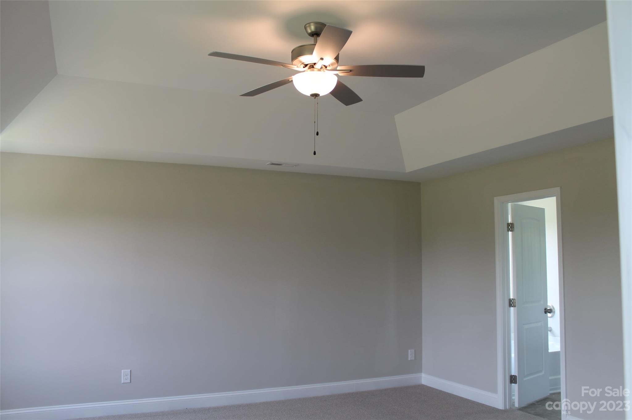 3818 New Salem Road Monroe, NC 28110 - Photo 12 of 15 an empty room with a ceiling fan and a window