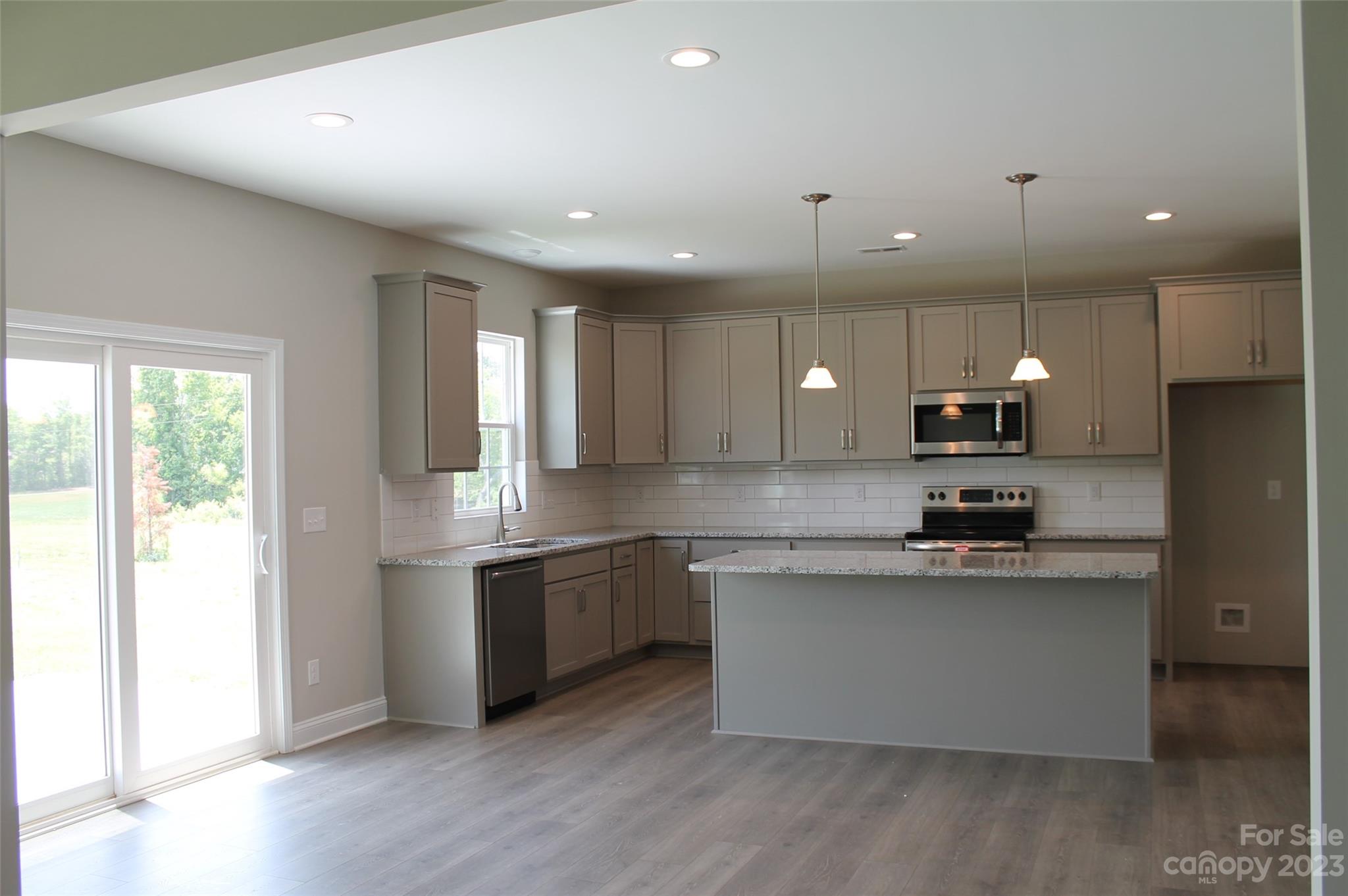 3818 New Salem Road Monroe, NC 28110 - Photo 2 of 15 a large kitchen with stainless steel appliances lots of counter space sink and a window