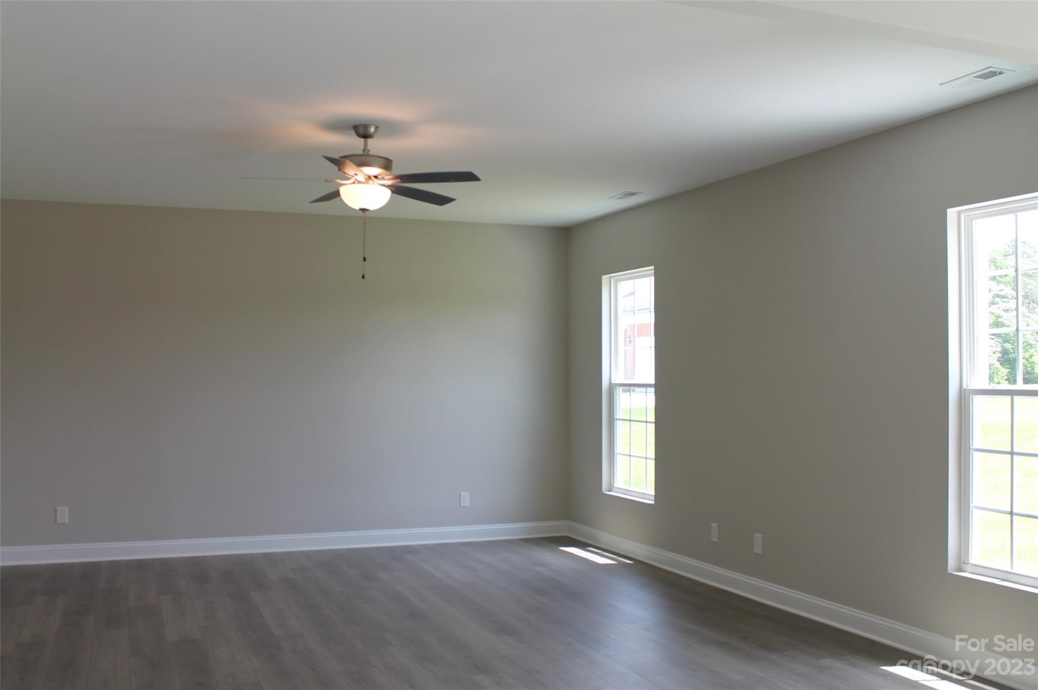 3818 New Salem Road Monroe, NC 28110 - Photo 8 of 15 wooden floor in an empty room with a window