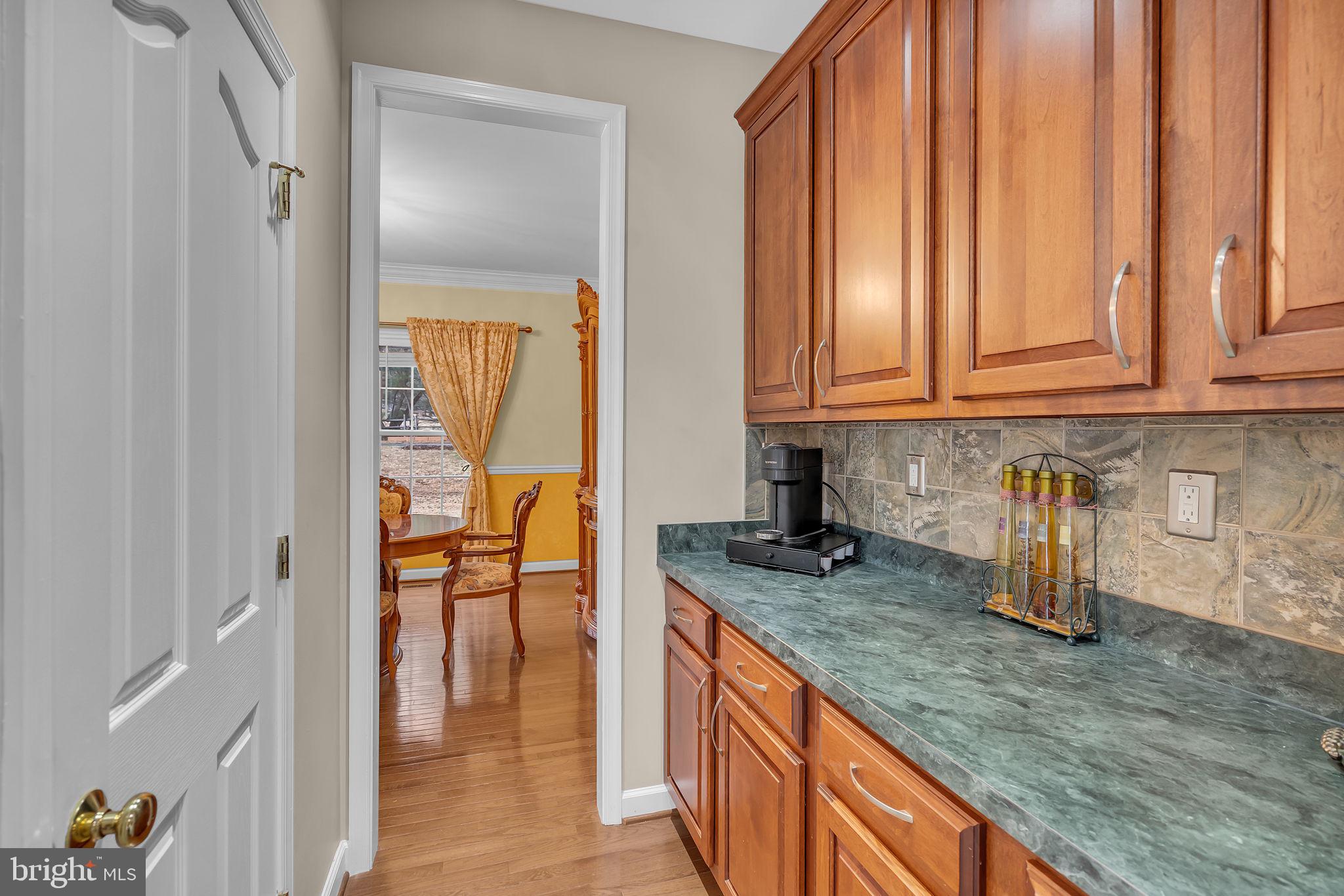 18631 Brick Store Road Hampstead, MD 21074 - Photo 13 of 64 a kitchen with stainless steel appliances granite countertop a stove a sink and a granite counter tops with white cabinets
