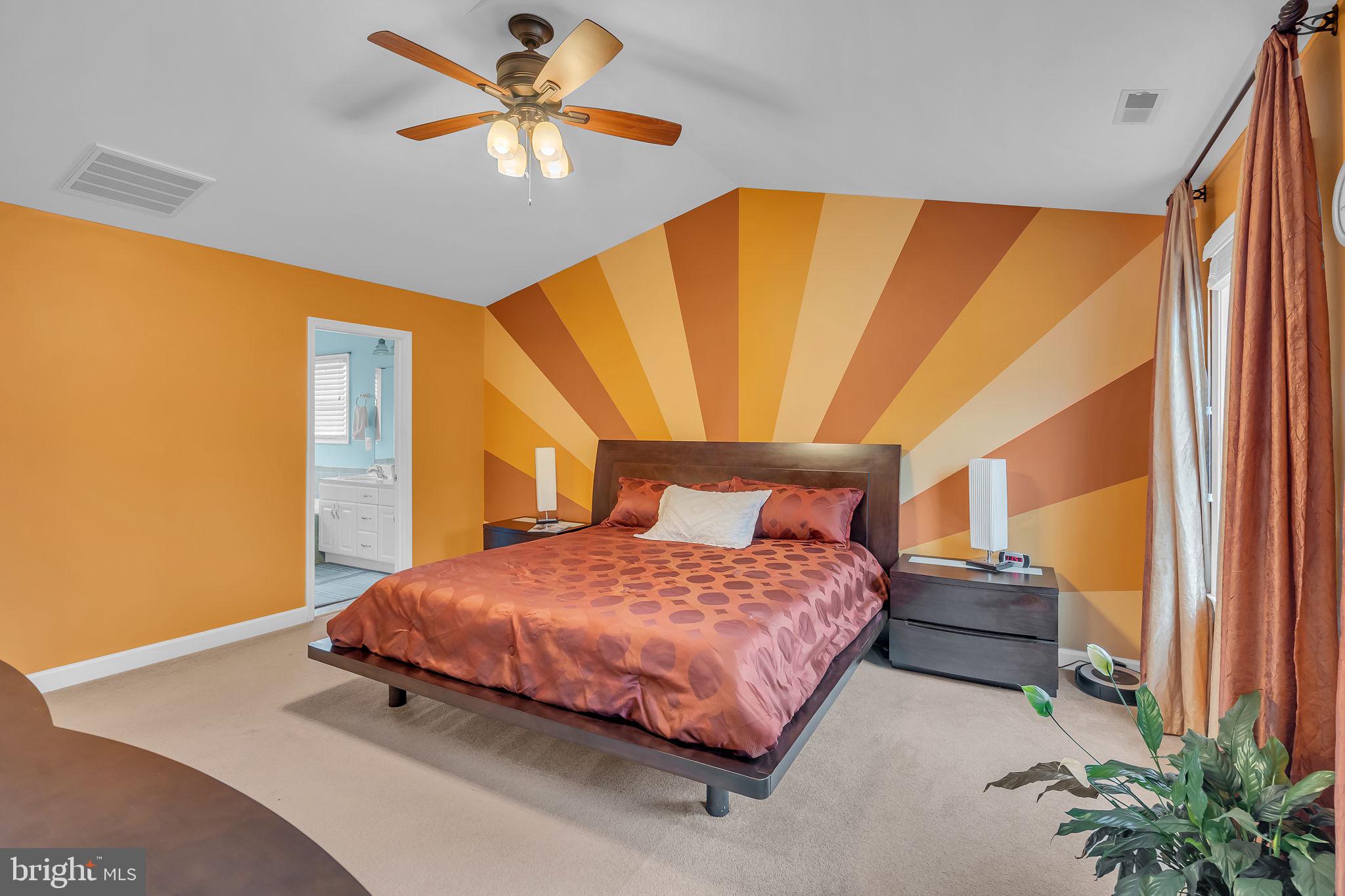 18631 Brick Store Road Hampstead, MD 21074 - Photo 26 of 64 a bedroom with a bed and a chandelier