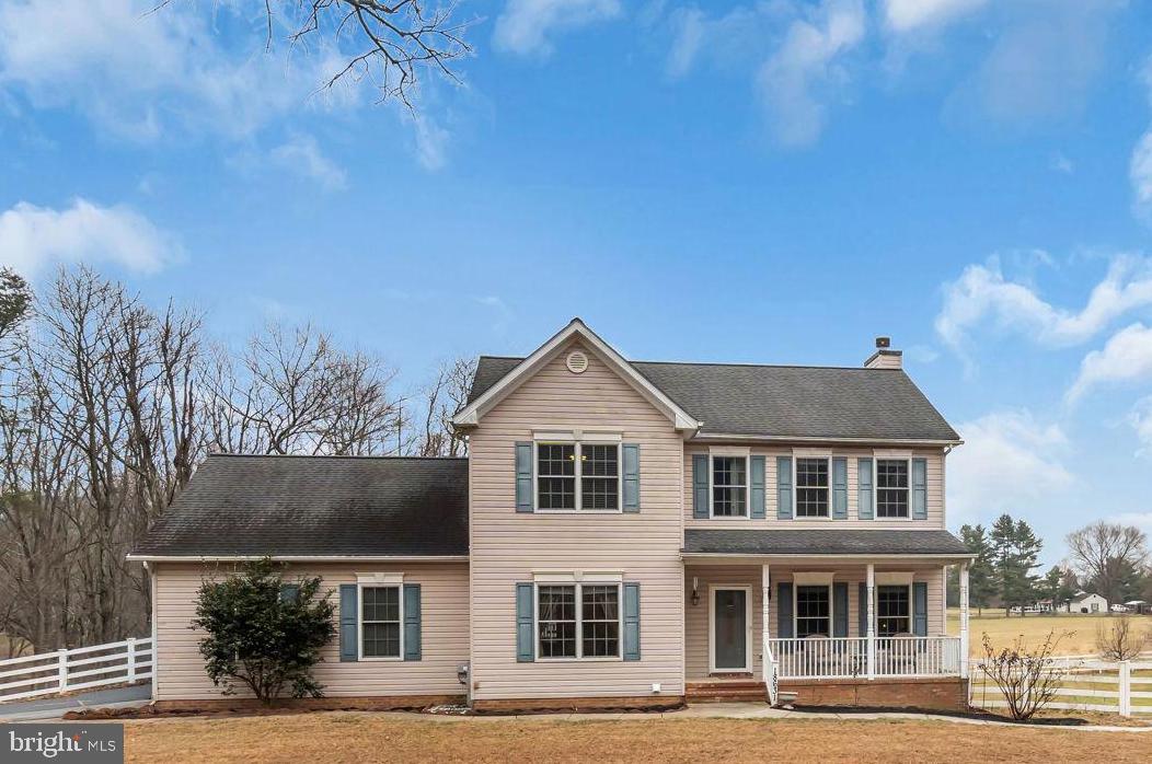 18631 Brick Store Road Hampstead, MD 21074 - Photo 3 of 64 a front view of a house with yard and parking