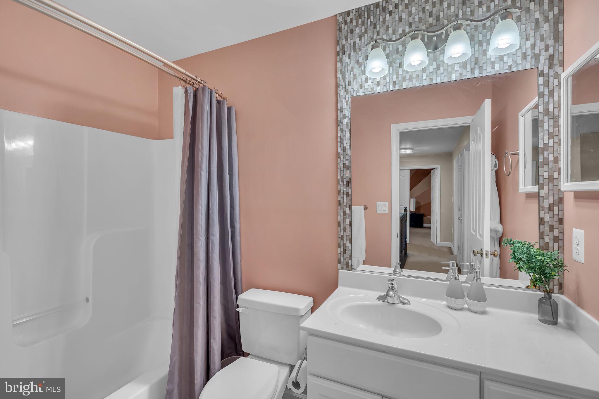 18631 Brick Store Road Hampstead, MD 21074 - Photo 33 of 64 a bathroom with a sink toilet and shower