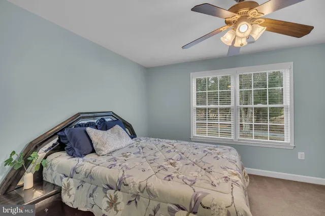 a view of a kitchen with cabinets and wooden floor