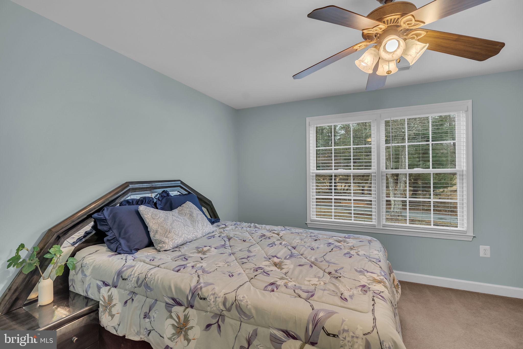 18631 Brick Store Road Hampstead, MD 21074 - Photo 37 of 64 a bedroom with a bed and a window