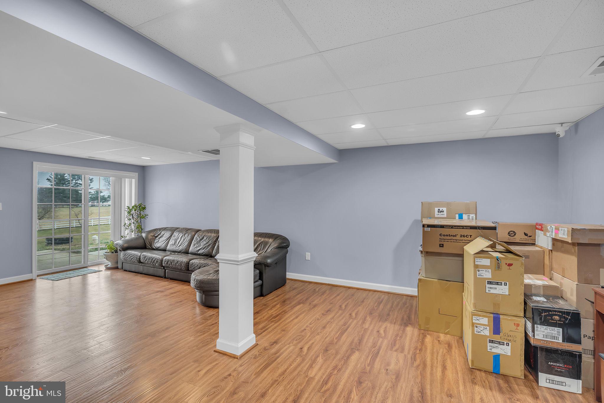 18631 Brick Store Road Hampstead, MD 21074 - Photo 38 of 64 a living room with furniture and a wooden floor