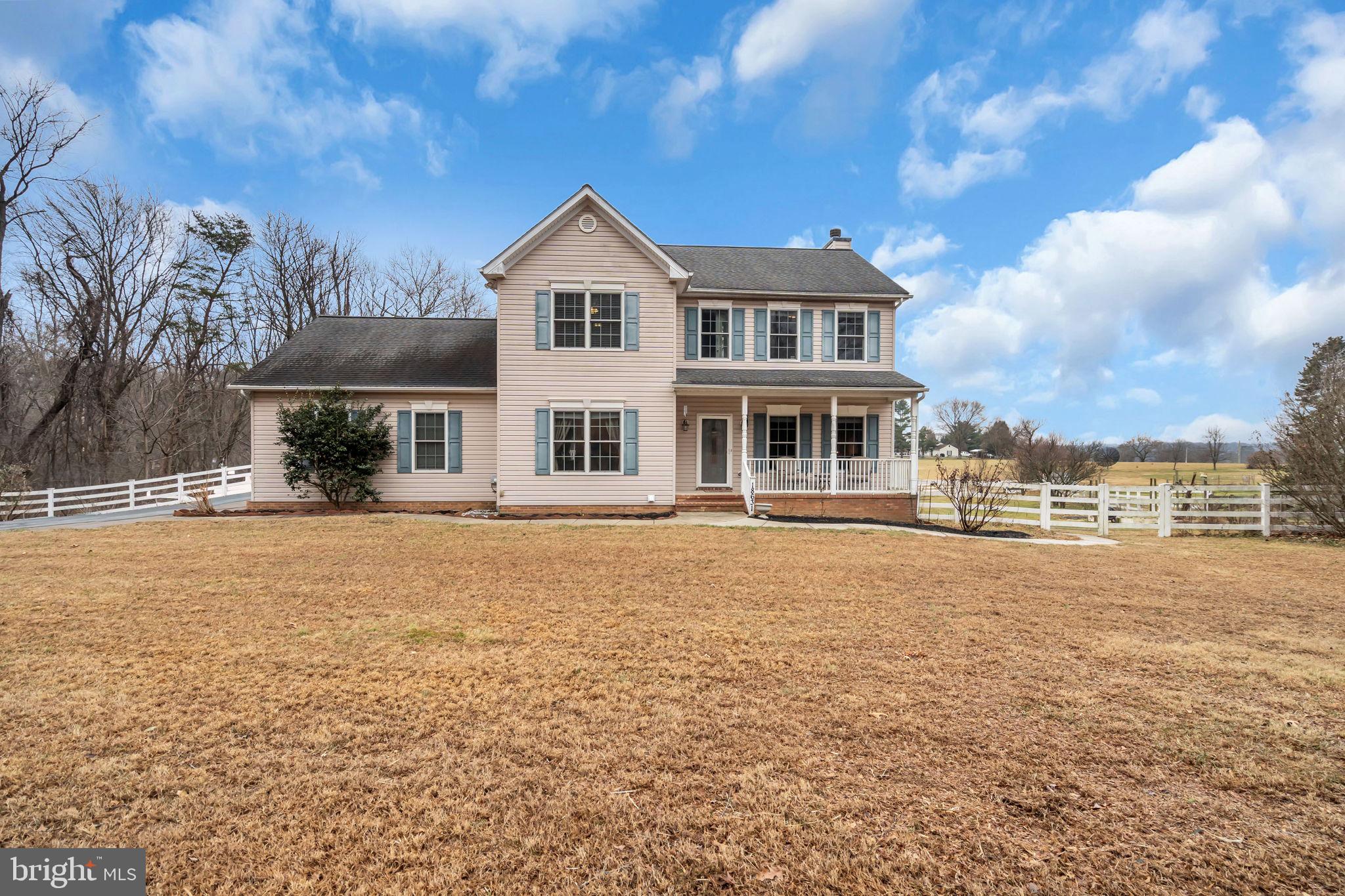 18631 Brick Store Road Hampstead, MD 21074 - Photo 4 of 64 a front view of a house with a yard
