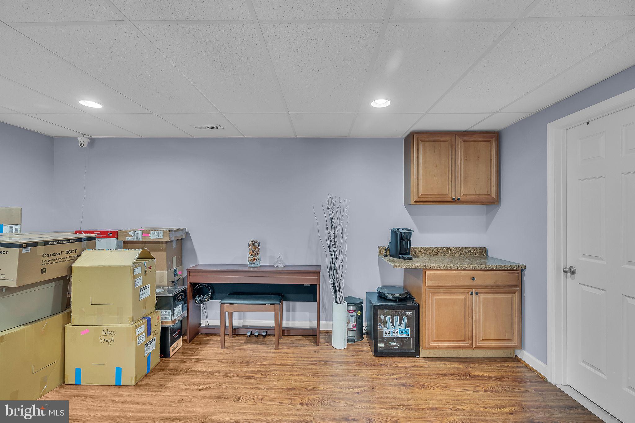 18631 Brick Store Road Hampstead, MD 21074 - Photo 41 of 64 a view of a kitchen with cabinets and wooden floor