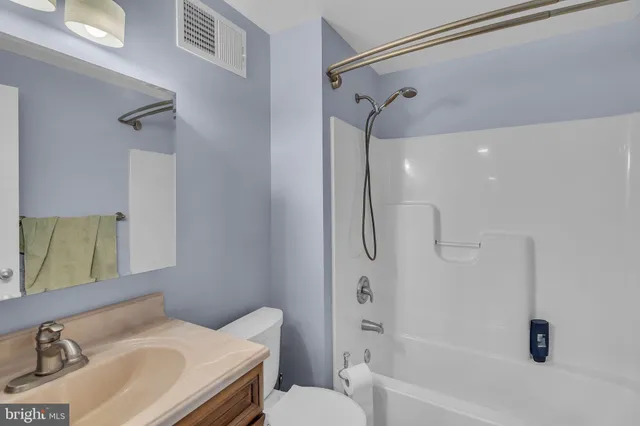 a view of a balcony dining table and chairs