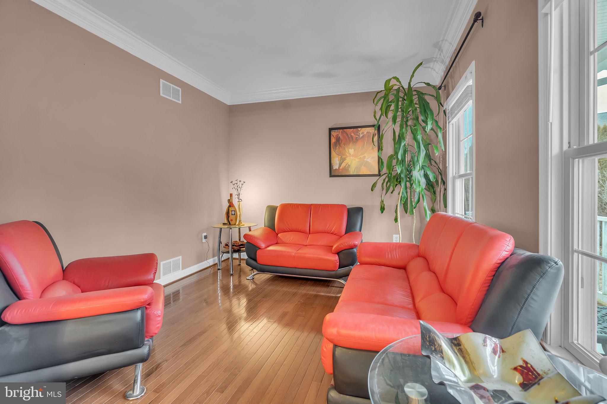 18631 Brick Store Road Hampstead, MD 21074 - Photo 9 of 64 a living room with furniture and a wooden floor