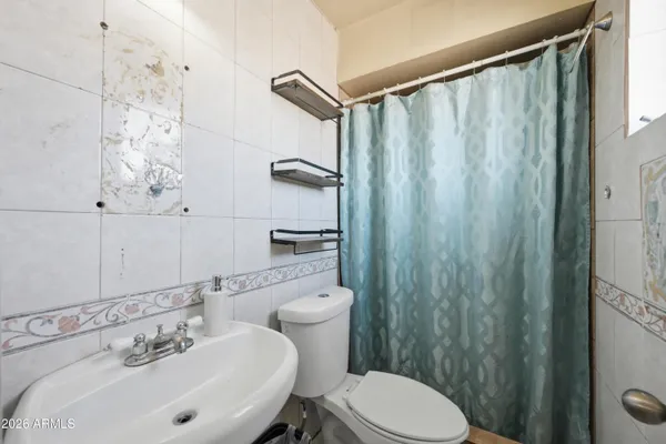 a kitchen with granite countertop a stove sink and cabinets