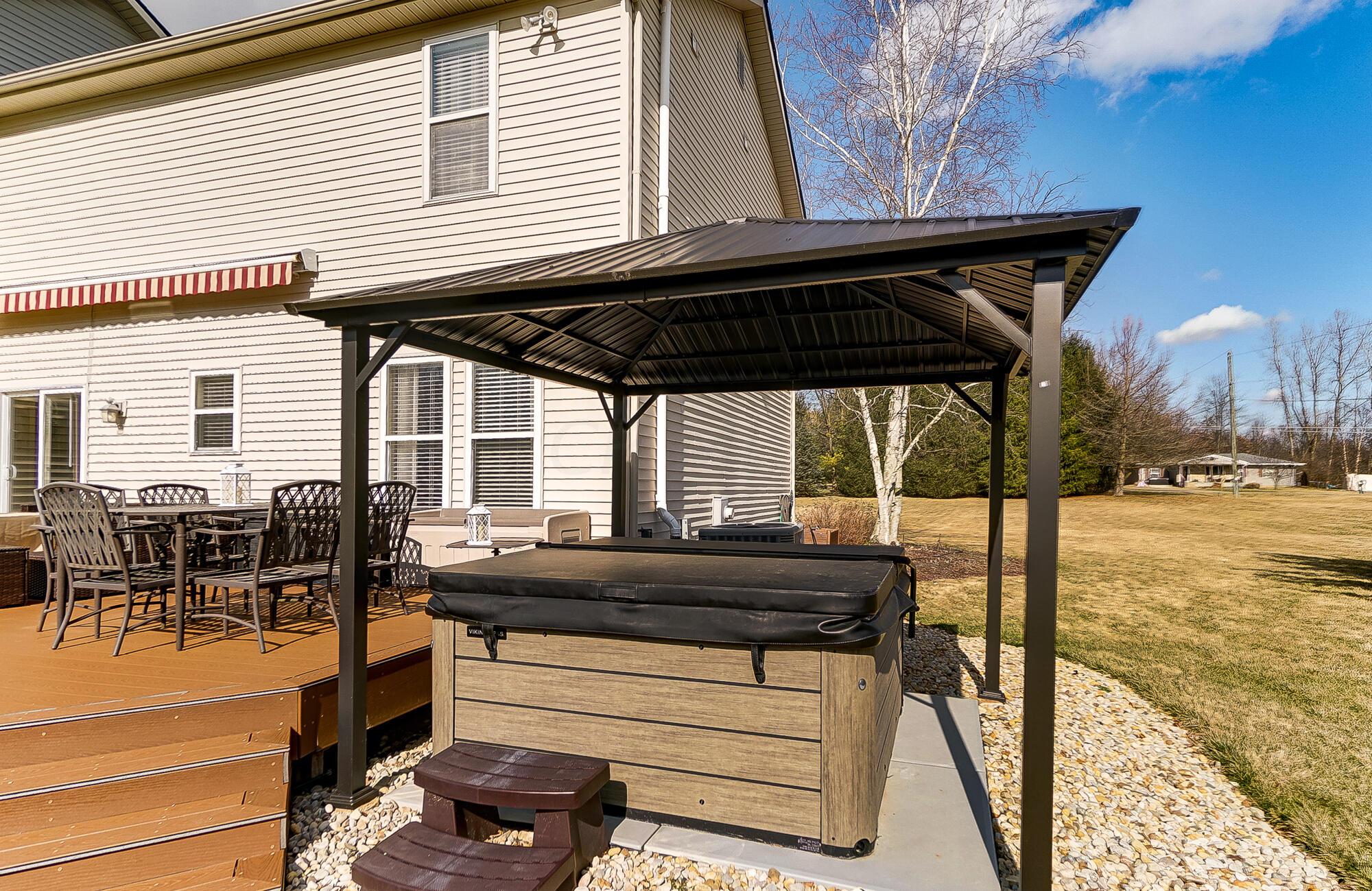 564 Kingsbury Road Delaware, OH 43015 - Photo 65 of 76 Enjoy watching the sunset while relaxing in the new hot tub
